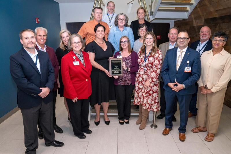 Successful Implementation of Follow-Up Manager for Navigation of Patient Diagnostic Testing Results award presentation attendees shown are in back (l-r) Brent Kuhlman, PACS administrator; Josh Wyatt, director of diagnostic imaging; Michele Mankins, RIS administrator; Loretta Ostroski; and Wendy Marsch, chronic care manager; middle row Mike Meoli; Mary McLoughlin, Dr. Paul C. Peet; and Matt Lukasiak. In front are Dr. William Chasanov; Sara Larch; Tara Cooper, RN, results nurse navigator; Kerri Watson, chronic care manager; Kristen Rios, data coordinator; Dr. Paul Sierzenski; and Bonnie Hall.